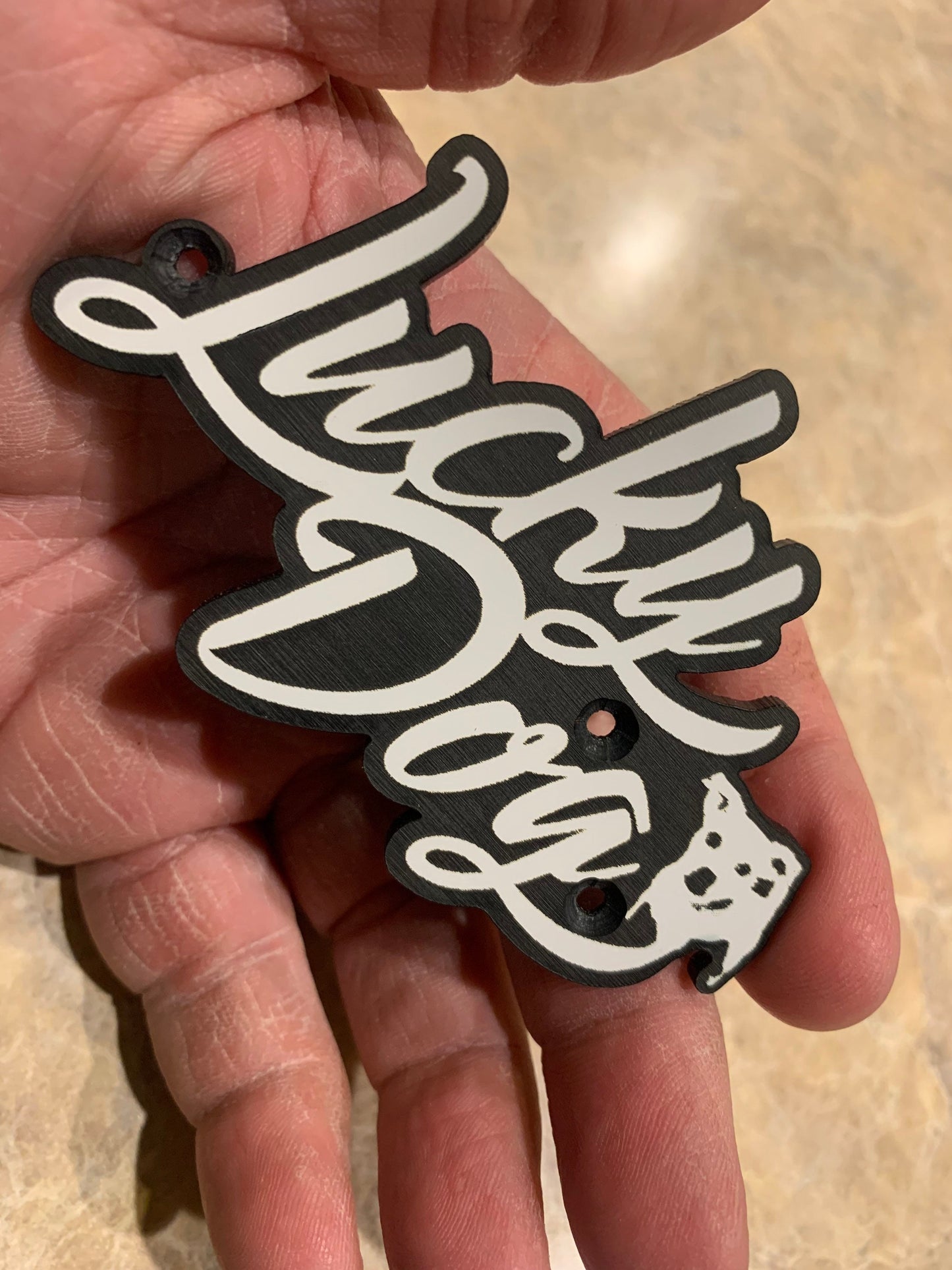 Lucky Dog Guitar case badge/logo. Also would work on amps, truck/car emblem etc. Tennessee made, very tough for high quality material. USA
