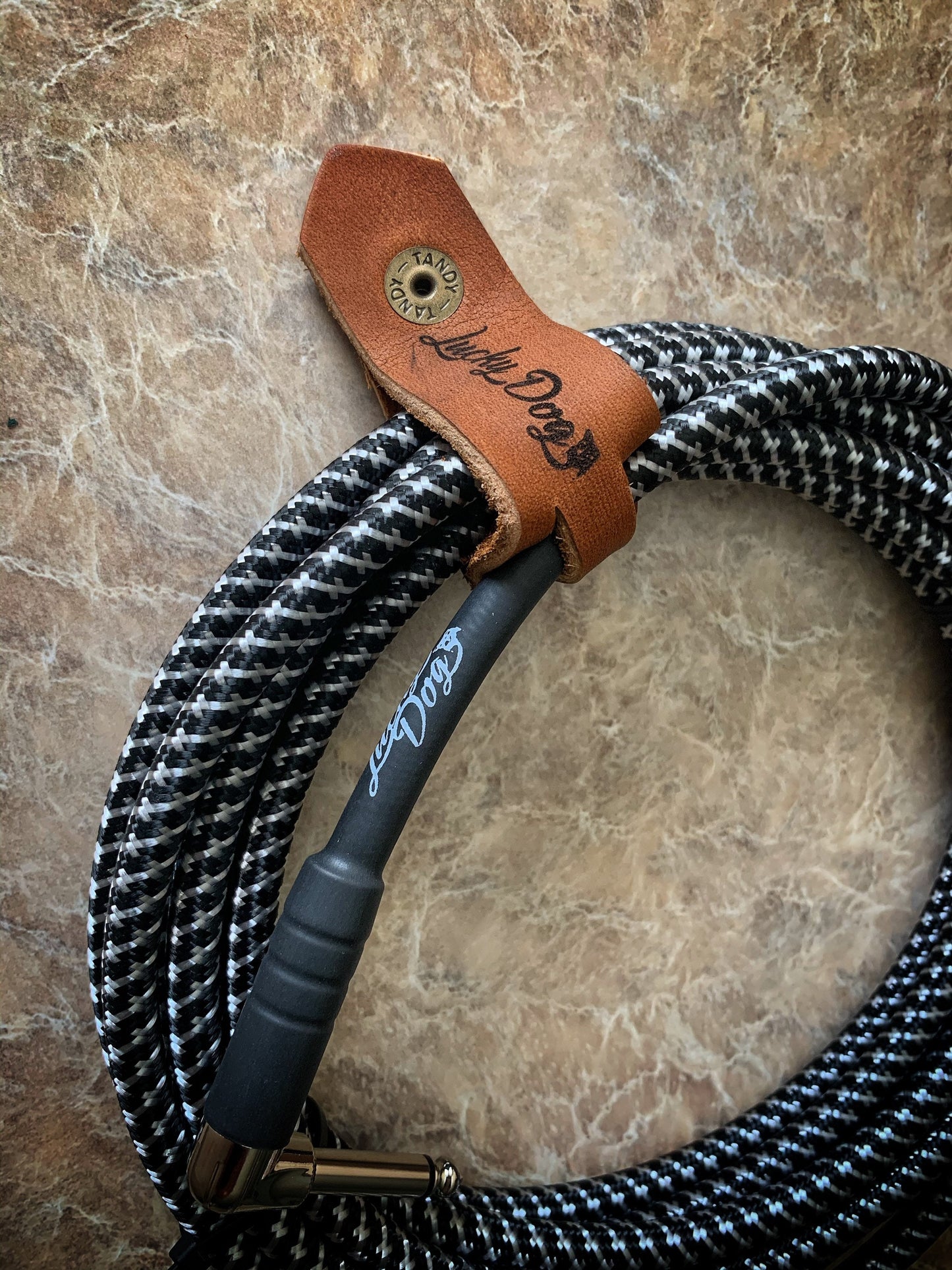 Lucky Dog Leather guitar cable wrap / retainer USA made, top quality leather and snaps. Engraved logo. Holds cables & keeps rolled up.